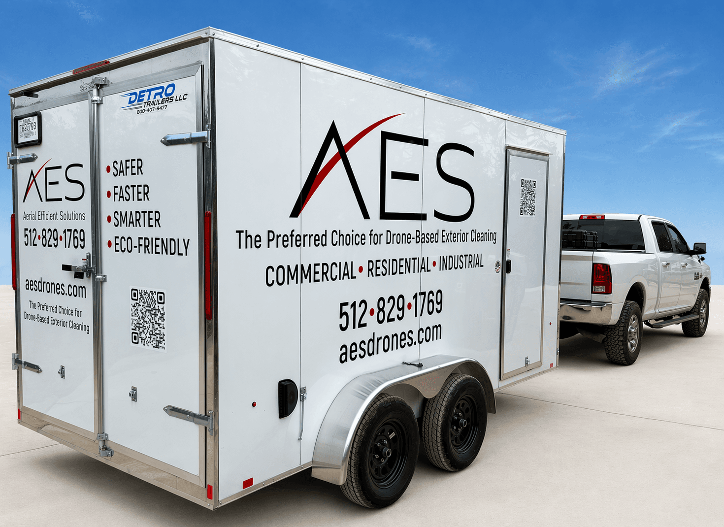 AES branded truck and trailer with the AES logo, phone number, and aesdrones.com